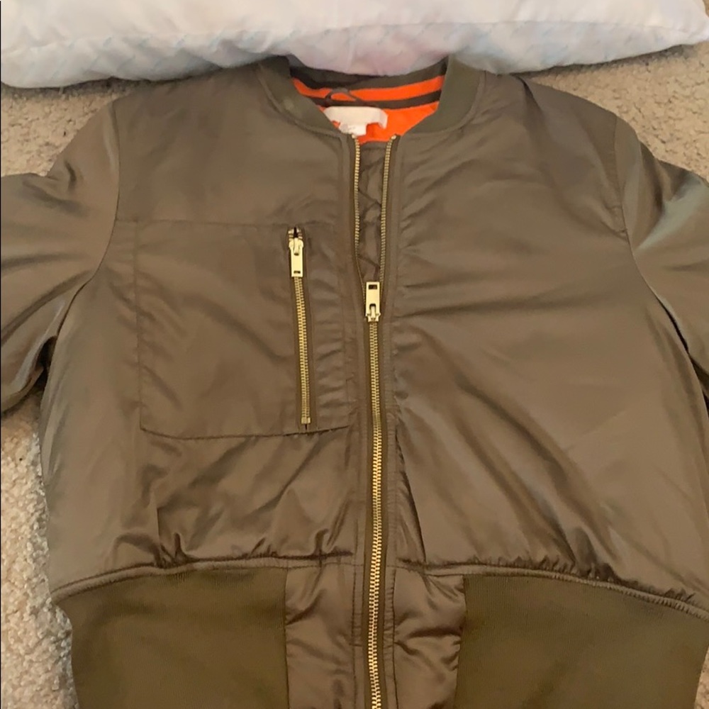 A olive green jacket.